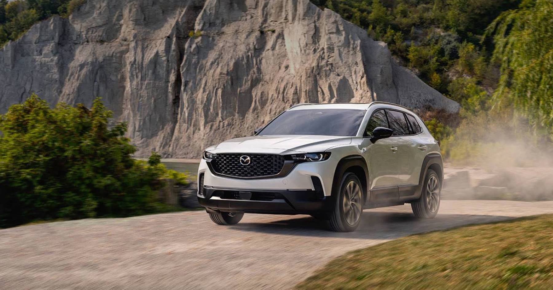 2025 Mazda CX-50 Hybrid driving in Dover, OH