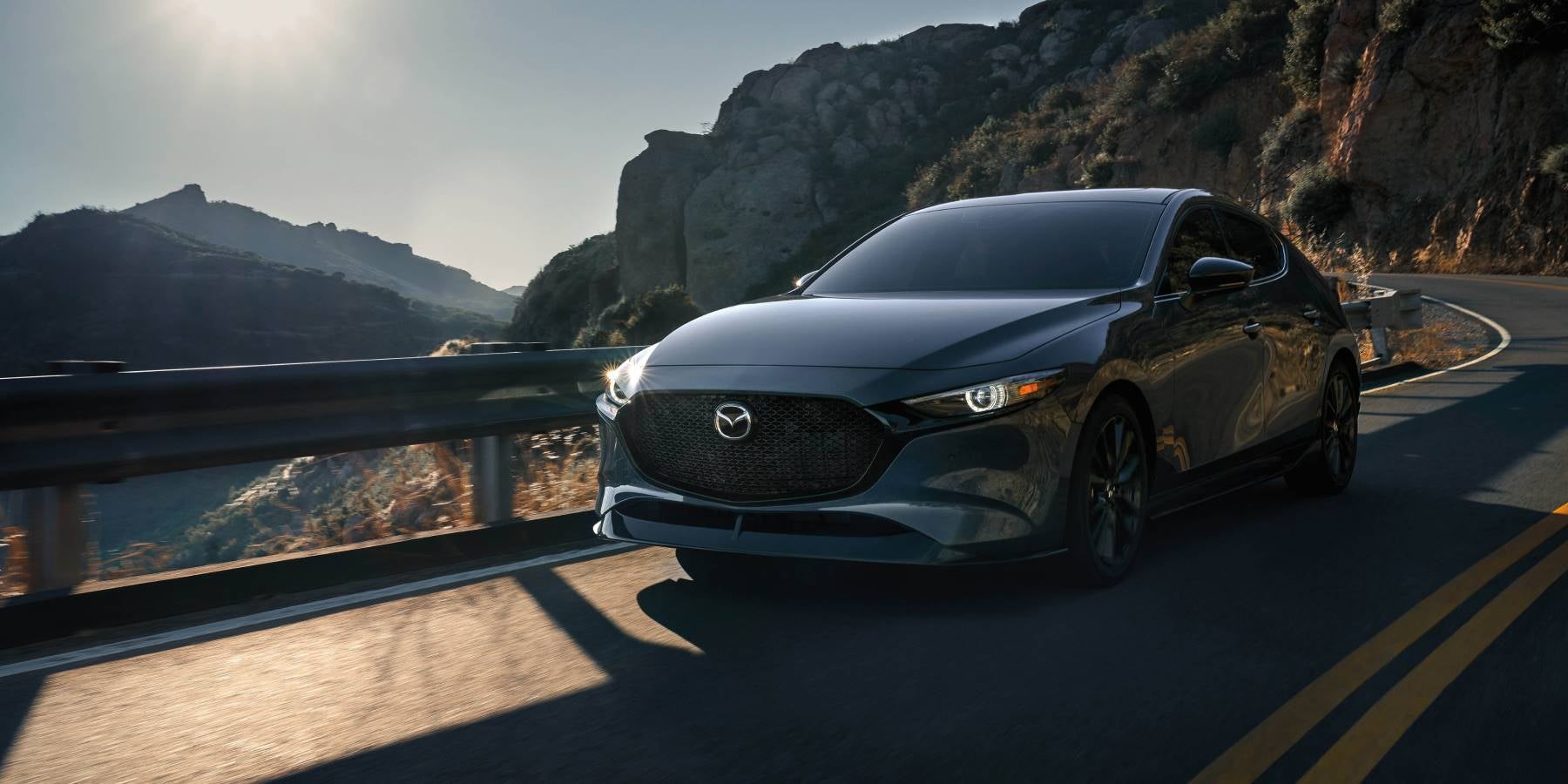 2025 Mazda3 Hatchback driving in Dover, OH