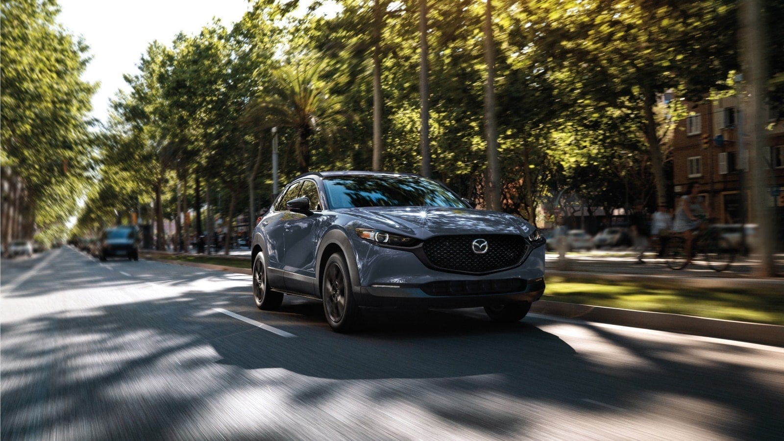 2025 Mazda CX-30 driving in Dover, OH
